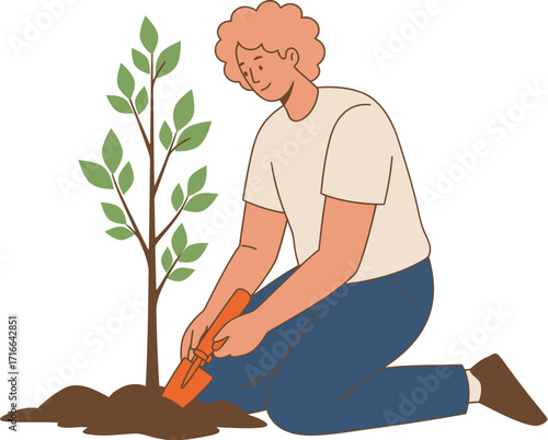 Young Man Planting a Sapling in the Soil