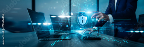 Analyst using laptop with analysis data Information Security protecting systems by monitoring threats. enhancing network defense, ensuring data safety supporting compliance improving resilience.