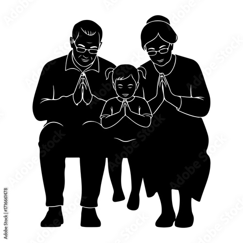 Family praying together in silhouette grandparents