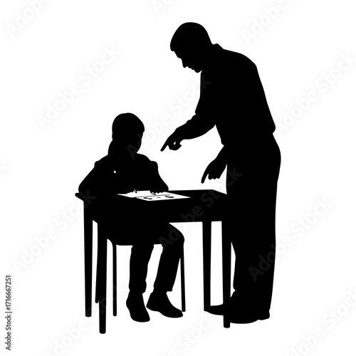 Teacher instructing student at desk learning education