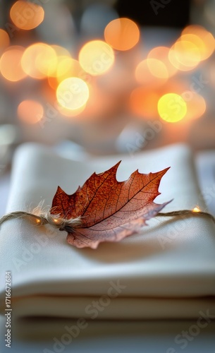 Elegant Table Setting With Autumn Leaf Centerpiece at a Cozy Gathering During...
