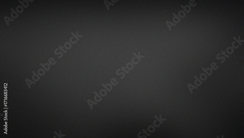 A grainy texture effect with a simple black background with a slight gradient, perfect for use as a backdrop or texture in graphic design and photography projects