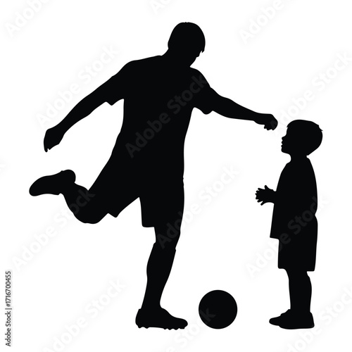 Father teaching son soccer ball