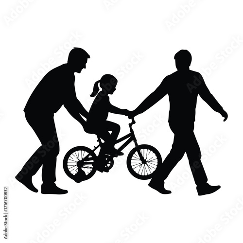 Fathers teaching daughter to ride bicycle learning