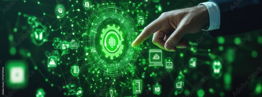 Obraz premium Businessman's hand pointing at green gear icon in digital interface representing technology, innovation, and futuristic concepts