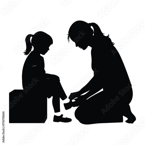 Mother helps child put on shoe putting on helping