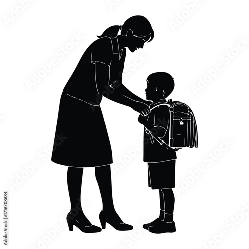 Mother helps son with backpack child school