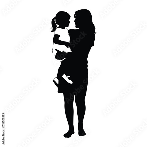 Mother holding child looking at each other silhouette