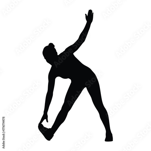 Silhouette of person stretching in triangle pose yoga
