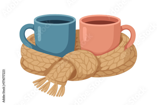 Cozy composition of two warm coffee and tea mugs in blue and pink colors wrapped in a knitted scarf, autumn and winter warm atmosphere for relaxing moments, hygge lifestyle concept