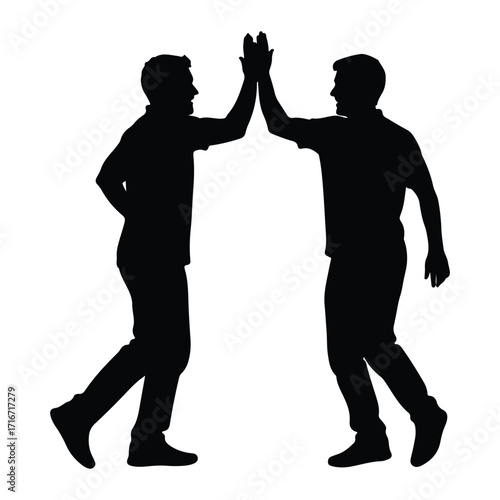 Two men high five silhouette celebration success