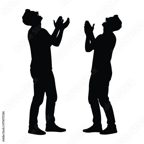 Two men laughing clapping hands silhouette