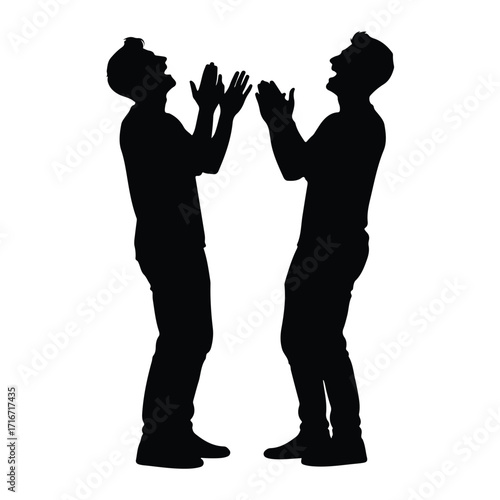 Two men laughing with hands raised silhouette clapping