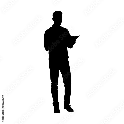 Silhouette of a man holding a tablet while standing indoors  