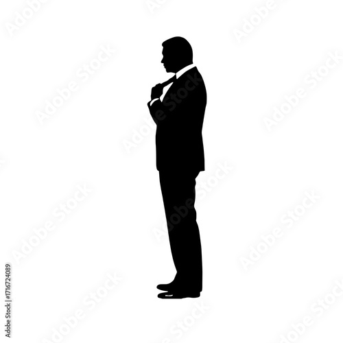 Businessman adjusting tie in profile silhouette on white background  
