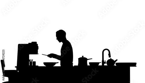 Man preparing food in kitchen silhouette against bright background  