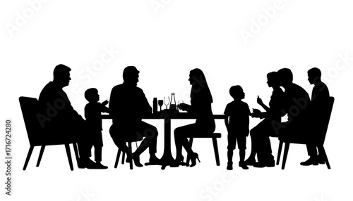 Family silhouette enjoying dinner together at a table with drinks  