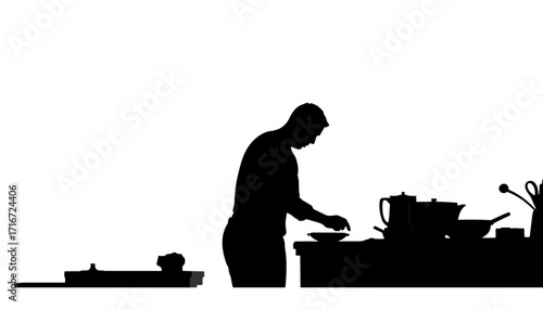 Silhouette of man cooking at kitchen counter with utensils and pots  