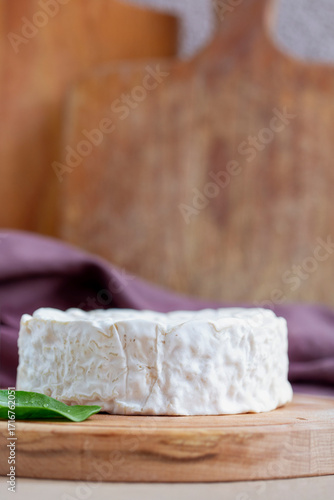 Camambert cheese on cutting board
