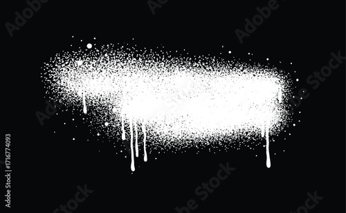 White color spray paint or graffiti design element on the black wall background.