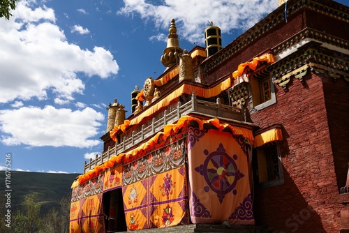 Colorful facade of Lo Drowolung Monastery in Lhozhag County, Lhoka (Shannan), Tibet, showcasing traditional Tibetan Buddhist architecture and intricate decorative details.