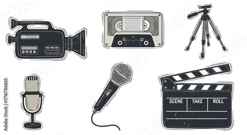 Vintage film and audio recording equipment collection featuring a camcorder microphone cassette and clapperboard