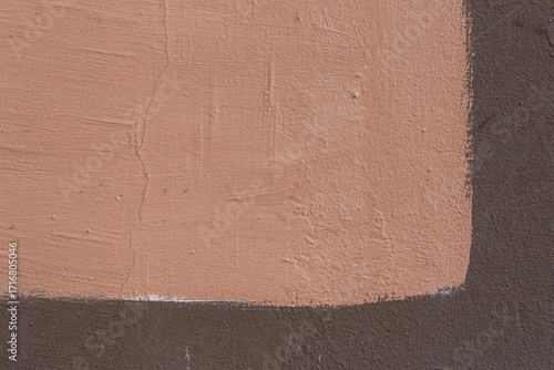 Texture of an old painted wall. The rough surface of a plastered wall painted in two colors. Perfect for background and design. Closeup.