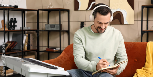 Young happy male composer w...