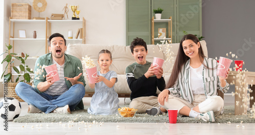 Excited family throwing pop...