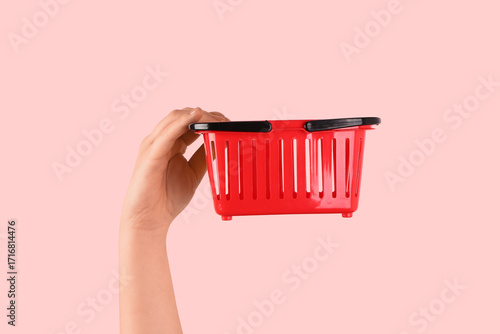Woman holding mini shopping...