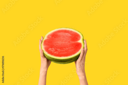 Fresh half watermelon held ...