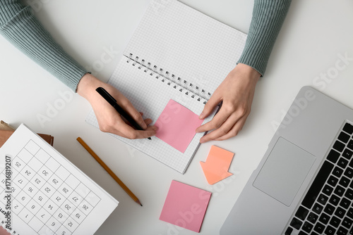 Young woman with calendar a...