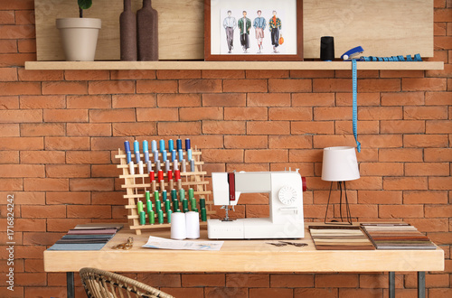 Tailor's workplace with sew...