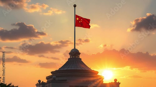 The national flag of China waving majestically atop a dome against a stunning golden sunrise sky, symbolizing hope and patriotism
