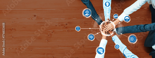 A dynamic scene showcasing business professionals collaborating in ethical decision making. Hands reach towards a central point, symbolizing unity and shared values. Amity