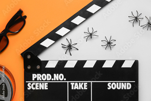 Clapperboard with spiders a...