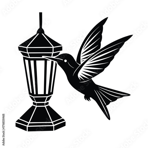 Hummingbird hovering near abstract feeder wings