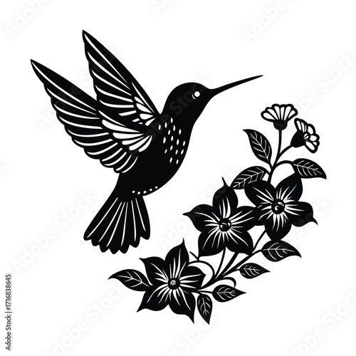 Hummingbird hovering near a small cluster of flowers