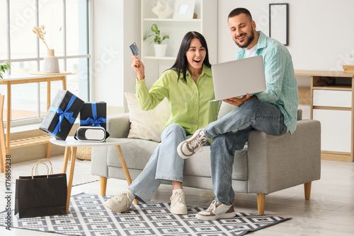 Young couple with credit ca...
