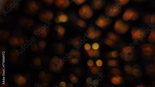 Abstract Bokeh Lights Background Warm Golden Tones and Dark Backdrop.