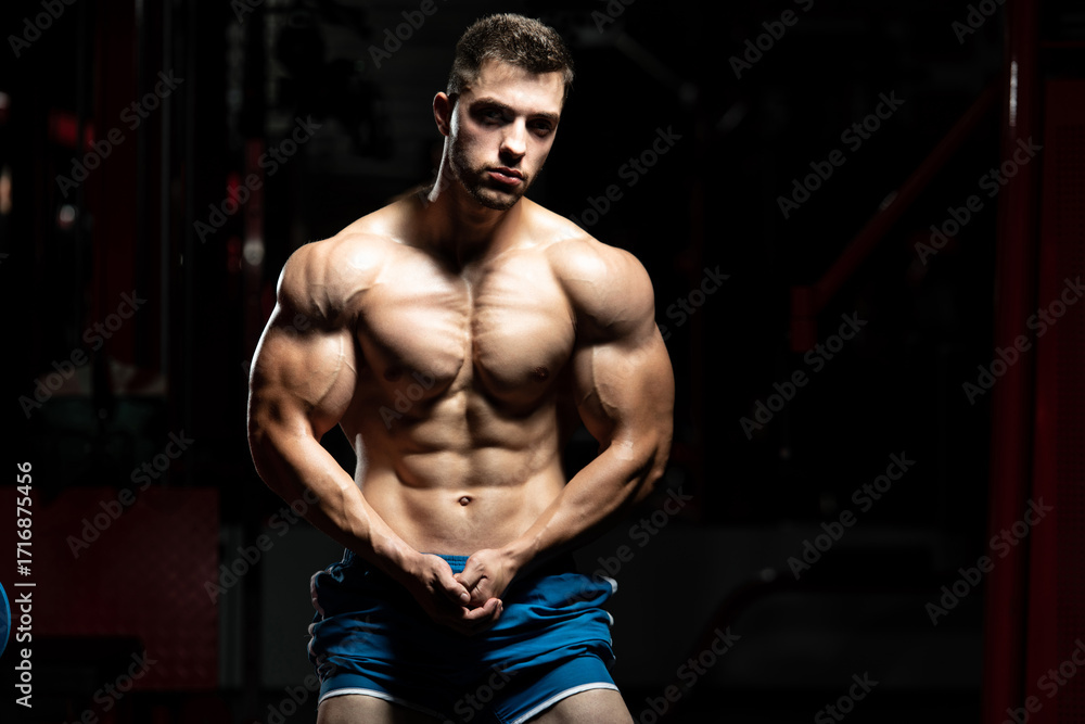 Fototapeta premium Young Man Showing Abdominal Muscle