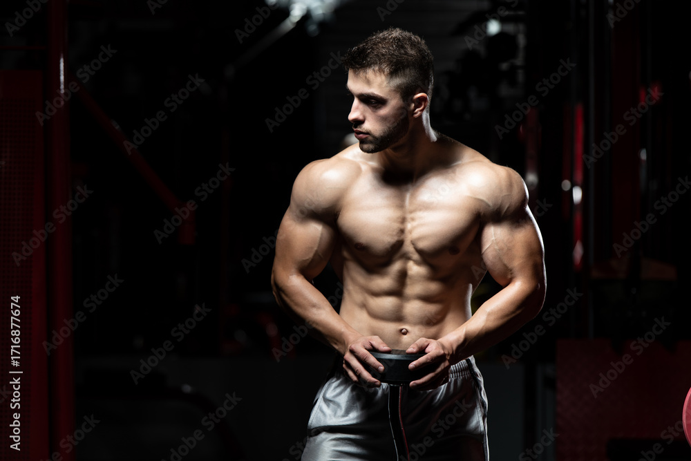 Fototapeta premium Tired Trainer After Training With Gym Weights