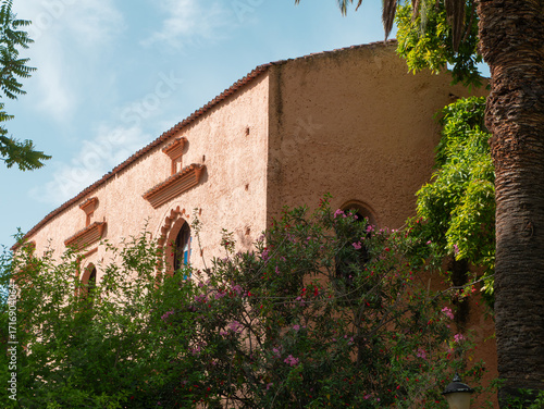 Historic Kasbah building with trees in Chefchaouen, Morocco