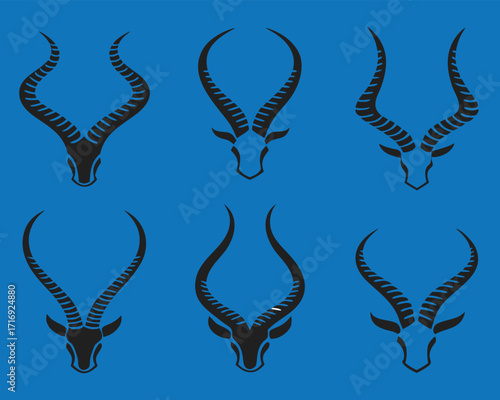 Elegant Silhouette of Antelope Heads with Striking Horns on Vibrant Blue Background