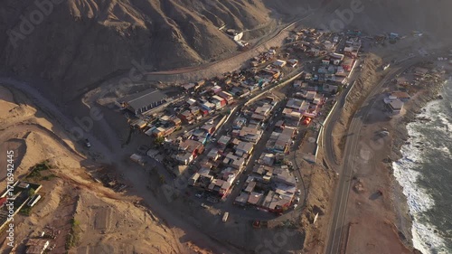 Aerial drone videos of a small fishing cove with boats and desert coastline near Antofagasta, northern Chile