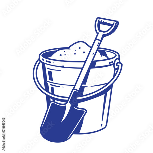 Blue and white sand bucket with shovel full of sand ready for playtime at beach