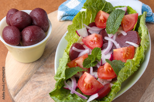 Sliced Baby Beetroot in an onion and tomatoe salad