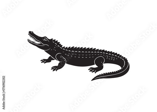Dangerous reptile silhouette of an alligator showing open sharp jaws.
