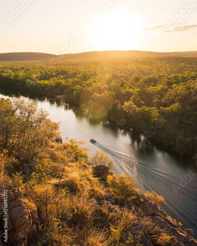 Sunset over the river with a boat