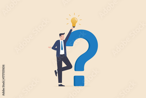 Businessman holding a glowing light bulb above a large blue question mark representing a new idea or solution